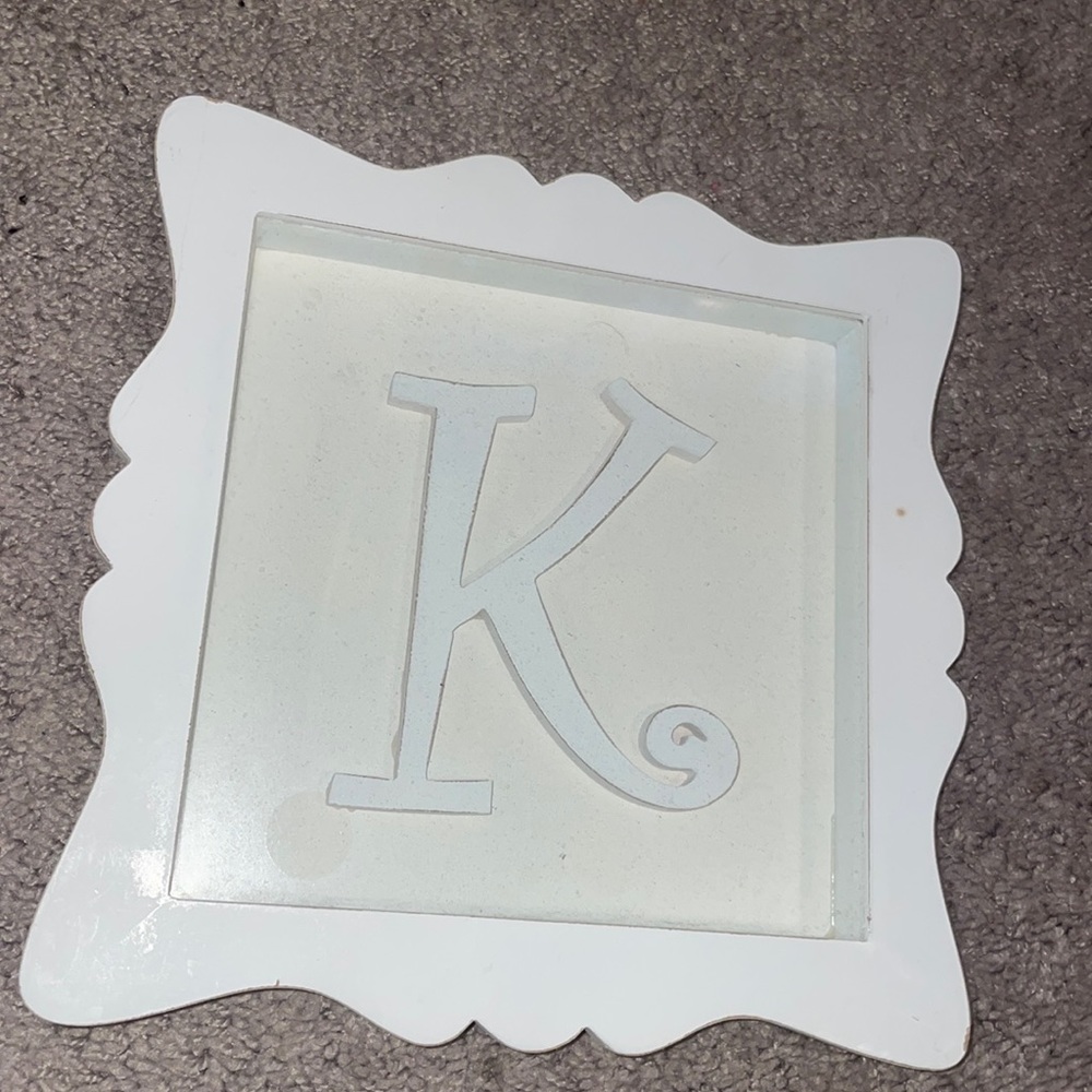White “K” sign